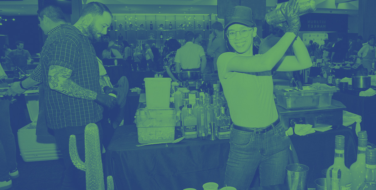 Bartender shakes a cocktail at Team Hidi