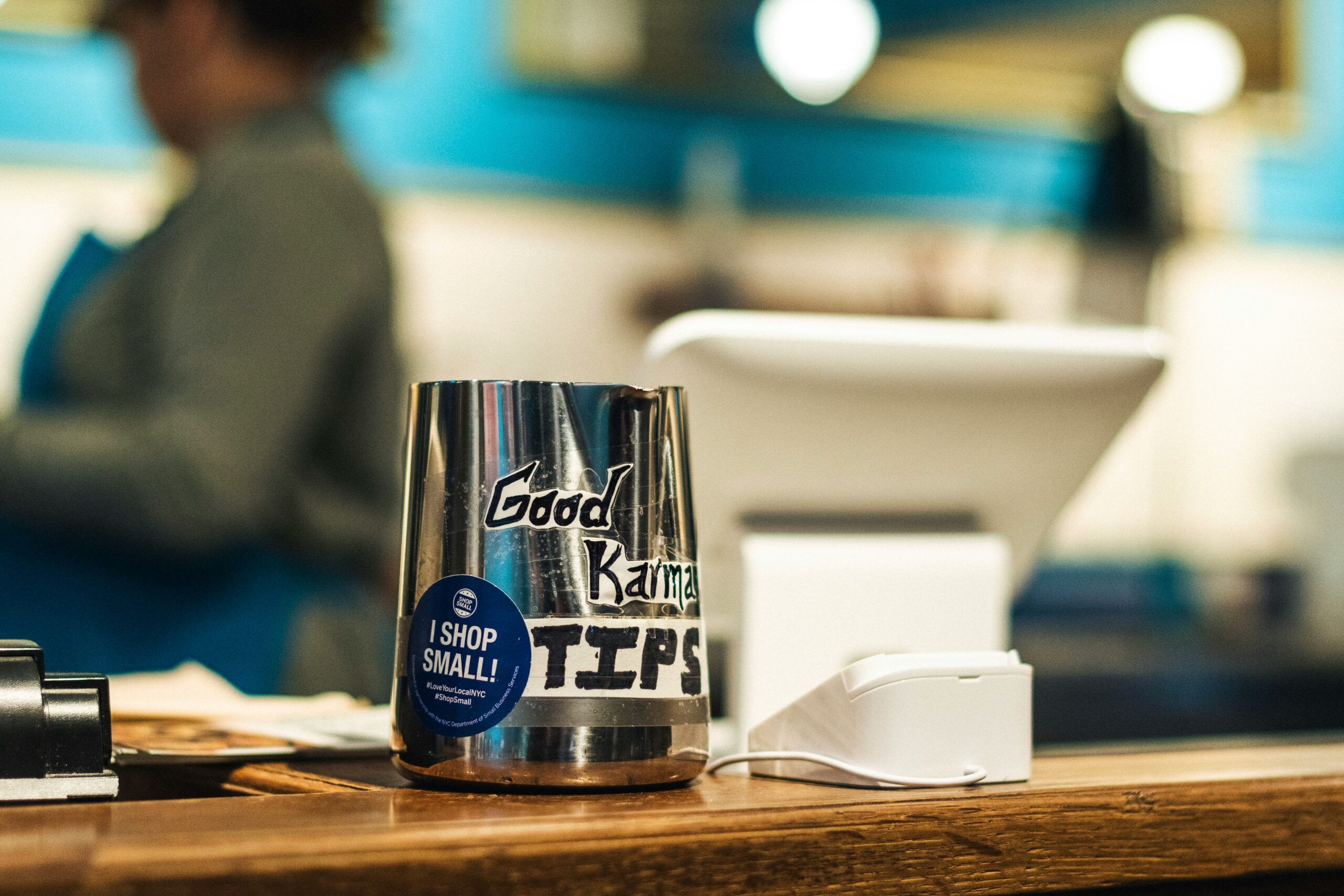Tip cup near a cash register