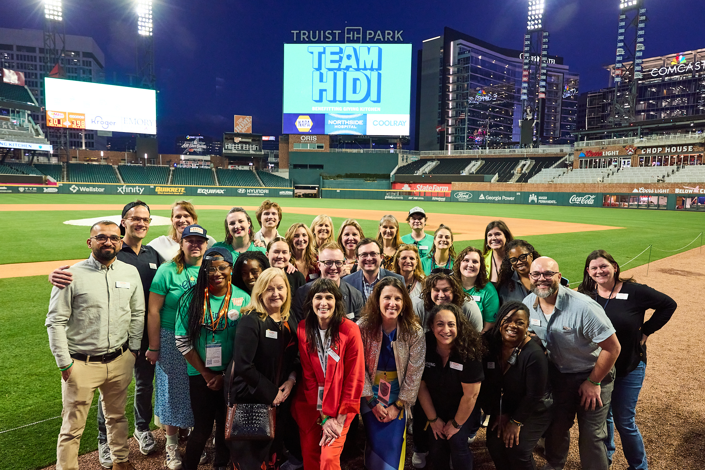 Giving Kitchen staff on the field at Truist Park during Team Hidi