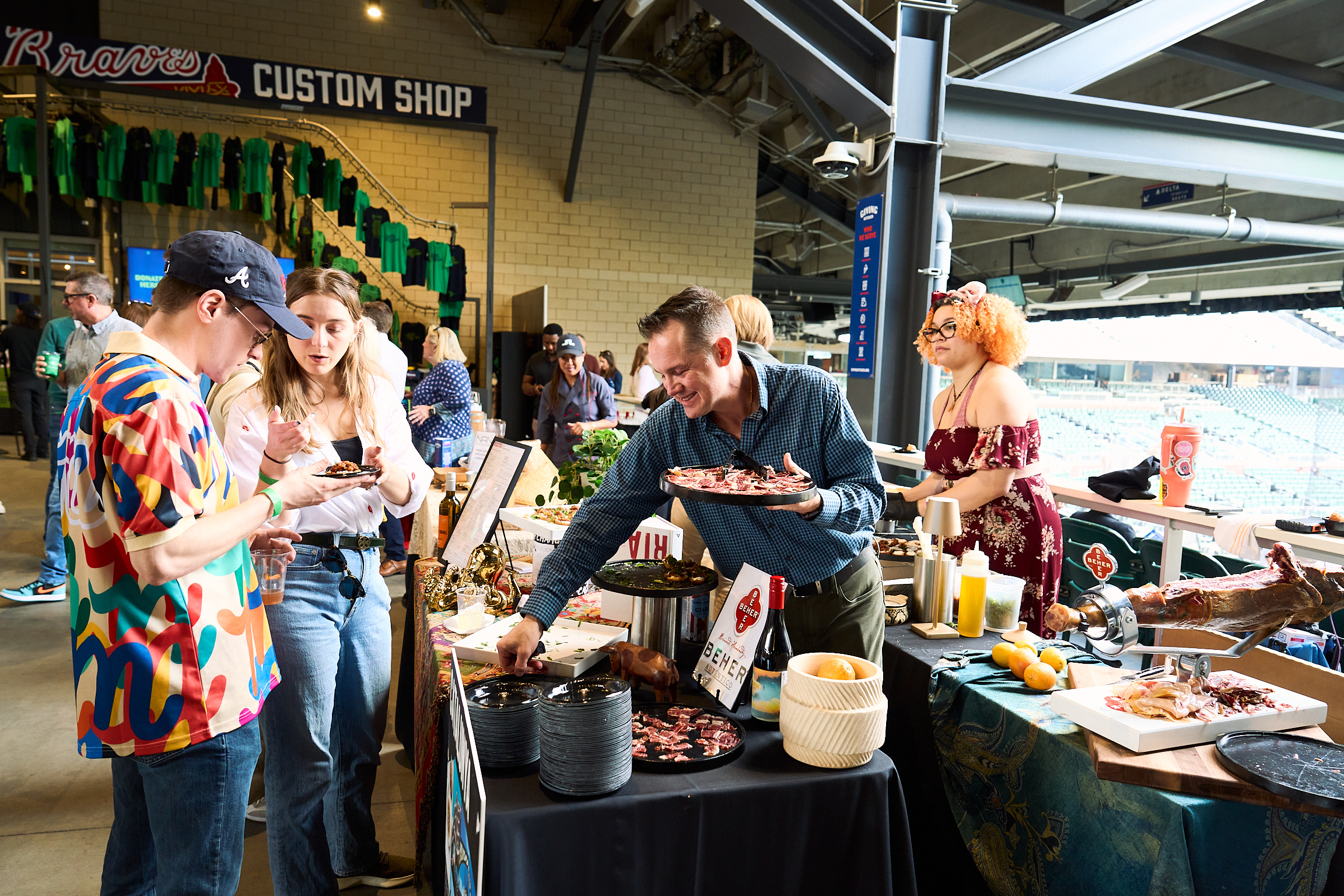 Guests pick up canapes at Team Hidi