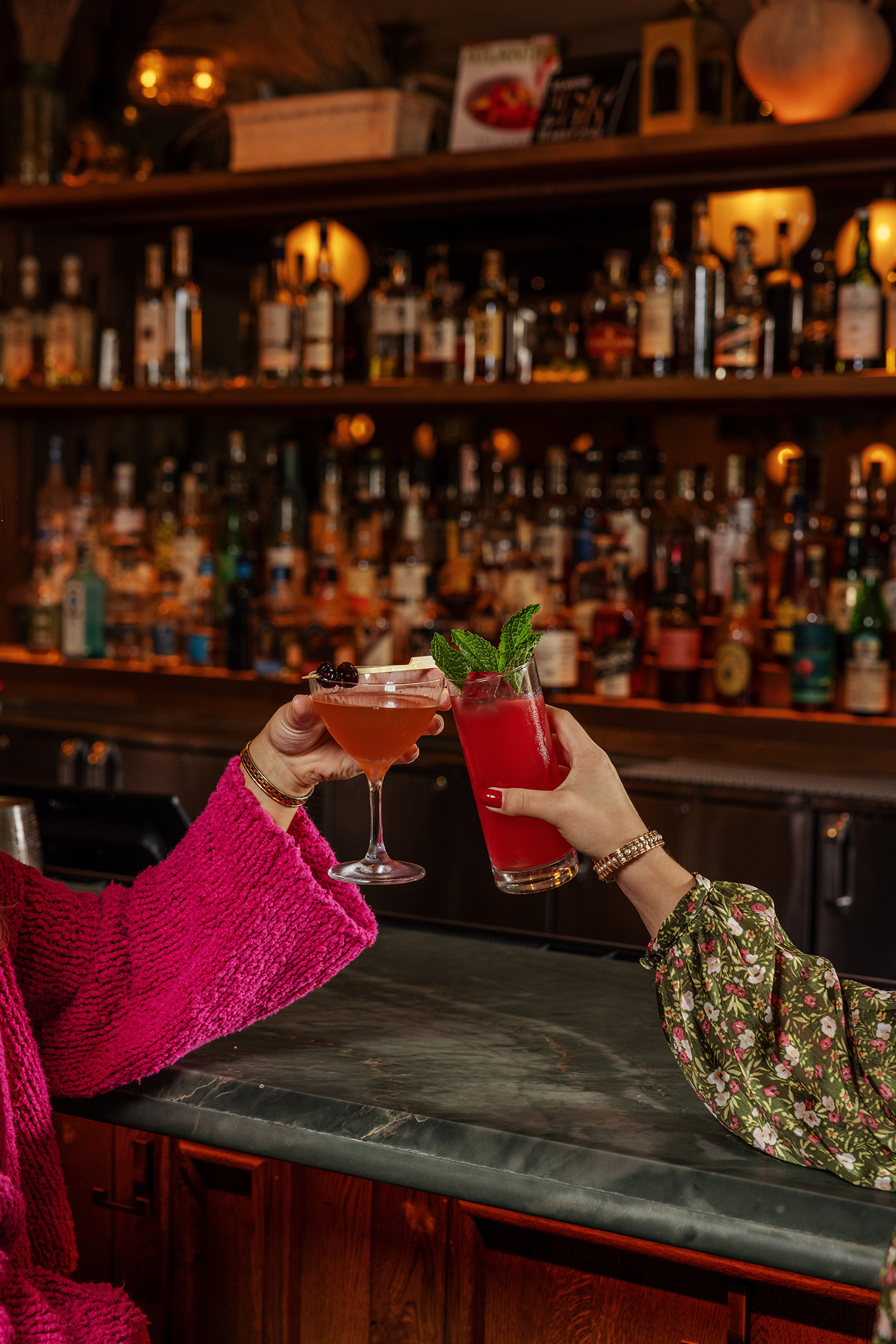 Guests toast cocktails at Ela