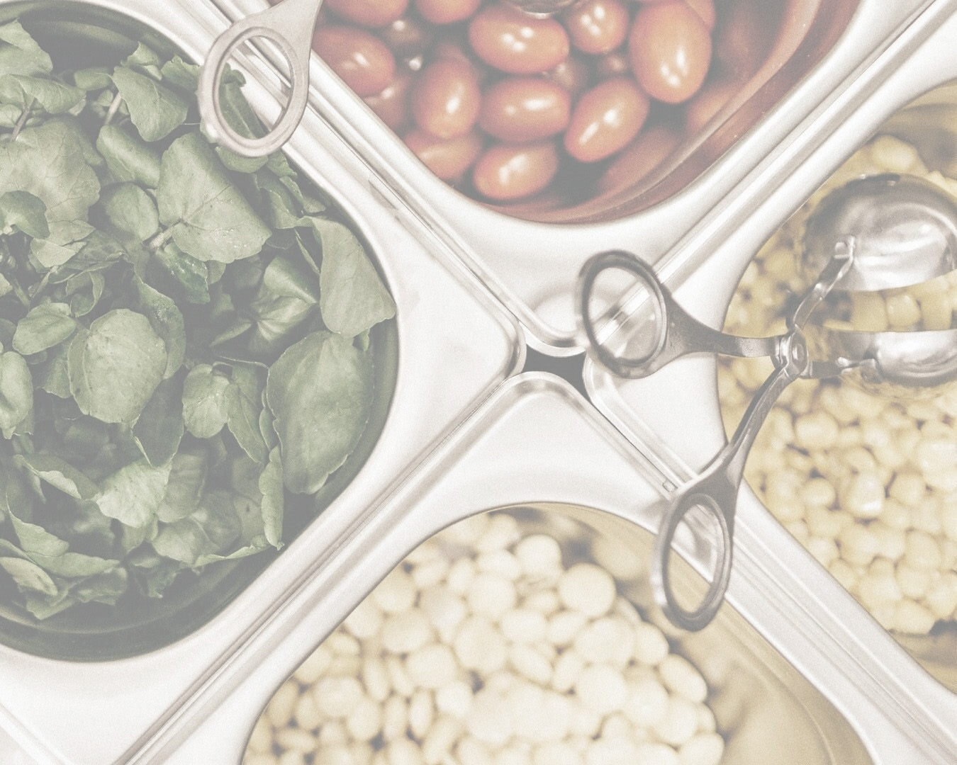 Containers of produce on a food prep line