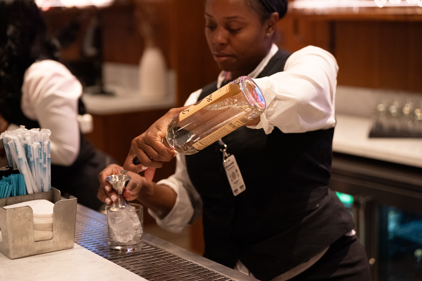 A bartender mixes a cocktail at Atlanta Hawks Forkside Seats fueled by Georgia Natural Gas