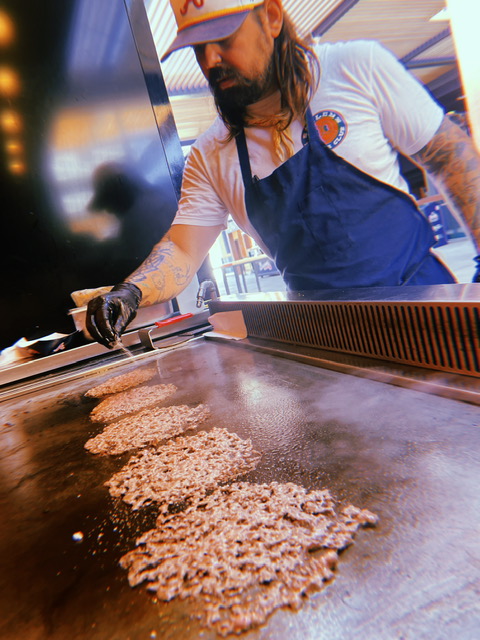 Smiley's Burger Club and Chef Ean support food service workers in crisis through the Atlanta Braves Outfield Market