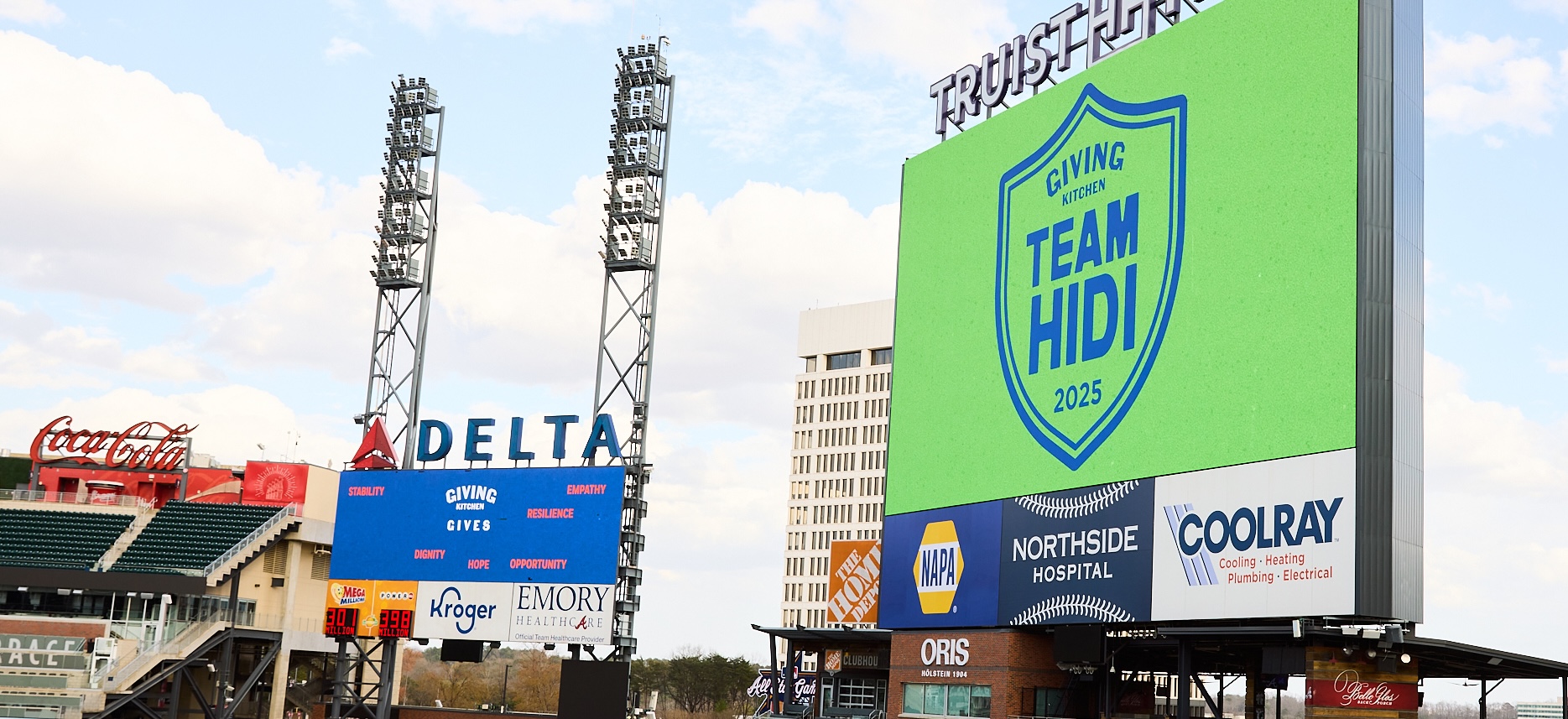 Scoreboards at Truist Park displaying Team Hidi logos