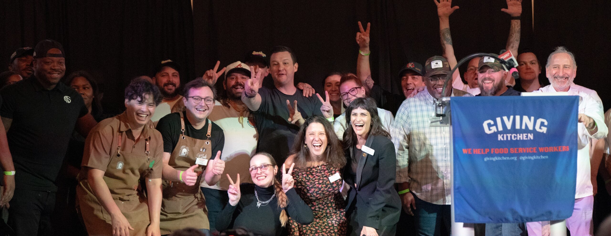 Chefs celebrate at a Giving Kitchen event.