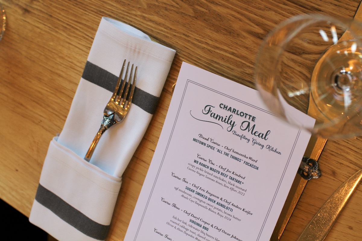 Menu at a place setting at Charlotte Family Meal