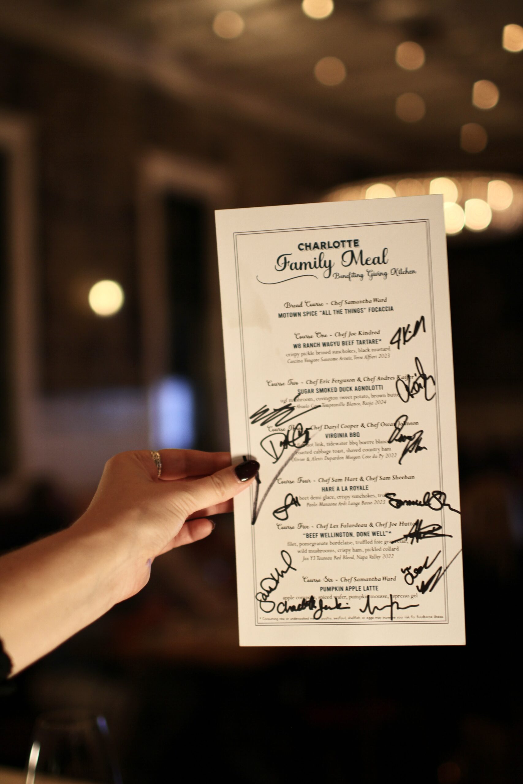 Menu signed by participating chefs at Charlotte Family Meal