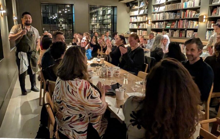 Guests gather around the table for Friendsgiving at Maxwell's Trading