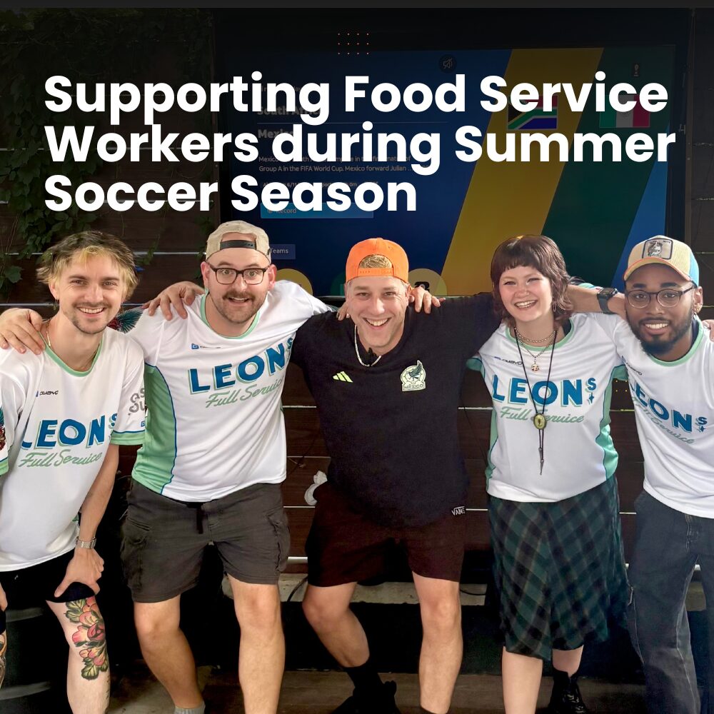 Food service workers wear custom jerseys at Leon's Full Service to celebrate summer soccer season