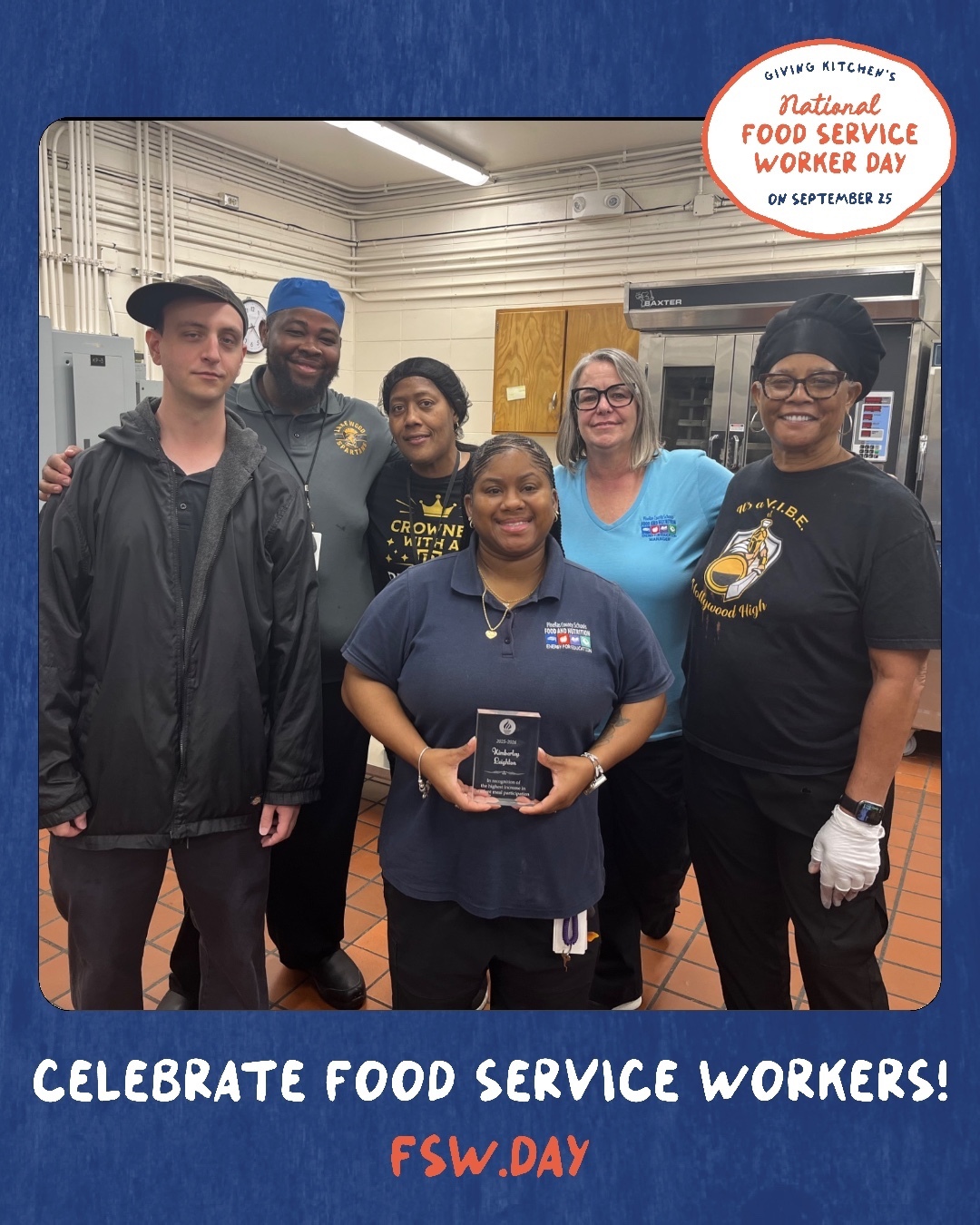 Cafeteria workers pose for a team photo